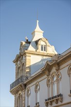 Stork on the tower of Belmarco Palace, landmark in Faro, Algarve, Portugal, Europe