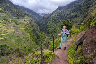 Hiker on Levada do Moinho, Ponta do Sol, Madeira, Portugal, Europe