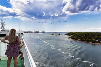 Passengers watching ferries, harbour entrance, Mariehamn, Aland Islands, Gulf of Bothnia, Baltic Sea, Finland, Europe