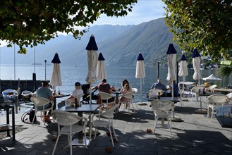 Restaurant on the lake promenade with a view of Lake Maggiore, Ascona, Canton Ticino, Switzerland, Europe