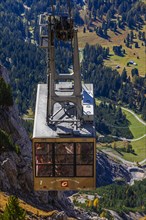 Cable car gondola in front of the entrance to the mountain station at the Seceda summit, Val Gardena, Dolomites, South Tyrol, Italy, Europe