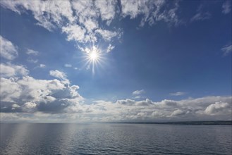 Cloudy atmosphere and sun star over Lake Constance, Constance, Baden-Wuerttemberg, Germany, Europe