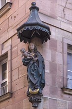 House saint, Mary with the child under a canopy on a historic residential and commercial building, Nuremberg, Middle Franconia, Bavaria, Germany, Europe