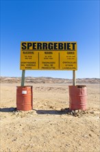 Warning sign at the diamond exclusion zone in the Sperrgebiet National Park, also Tsau ÇKhaeb National Park, Namibia, Africa