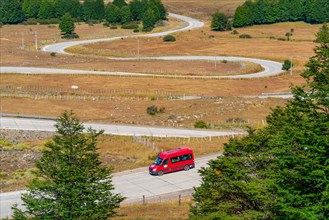 Red van in the Curvas del Diablo, serpentines of the Carretera Austral, also Panamericana, Cerro Castillo National Park, Aysen, Patagonia, Chile, South America
