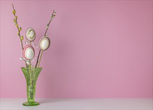 Flower pin, Easter eggs, green vase, pink background, copy room