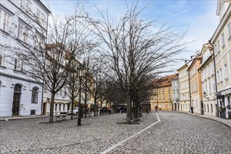 Prague, Czech Republic, February 23, 2023: Na Kampe Square is located at the base of the Charles Bridge on the castle side of the river at Kampa Island. This scenic square is bordered with historical ...