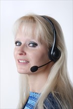 Portrait of young woman with headset