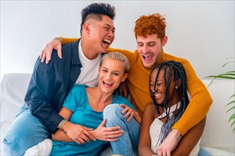 Lgtb couples of gay boys and girls lesbian in a portrait on a sofa at a house party, having fun