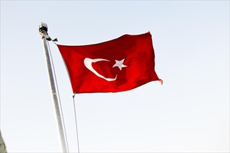 Turkish national flag hang on a pole in open air