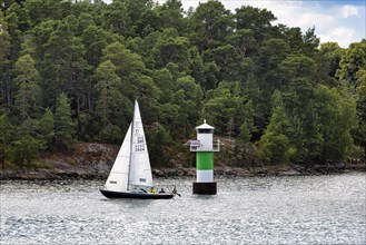 Sailing boat, underway in the archipelago near Stockholm, Sweden, Europe