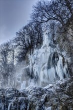 Icicles at the waterfall, permafrost with icy landscape, Swabian Alb, Bad Urach, Baden-Wuerttemberg, Germany, Europe