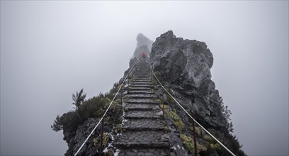 Hiker, Pico Arieiro to Pico Ruivo Hike, Rock Cliff Hiking Trail, Central Mountains of Madeira, Madeira, Portugal, Europe