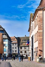 Strasbourg, France, February 2020: Street in historical Petite France quarter in Strasbourg city on sunny winter day, Europe