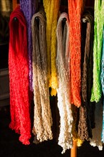 Empty mesh bags of various color at a market place