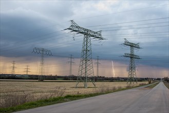 Thunderstorm cell with lightning, power pylons at Wolmirstedt substation, starting point for the southeast link, Wolmirstedt, Saxony-Anhalt, Germany, Europe
