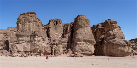 Tourist looking at the rock towers Solomons Pillars, Timna National Park, Negev, Israel, Asia