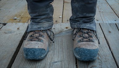 Dirty trekking shoes on the mountain trail. Dolomites, Italy, Dolomites, Italy, Europe