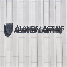 Lettering with coat of arms on facade, Aland Parliament, Mariehamn, Aland Islands, Aland Islands, Finland, Europe