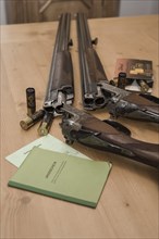 Decorated hunting weapons with ammunition, hunting license and gun ownership card and, Hesse, Germany, Europe