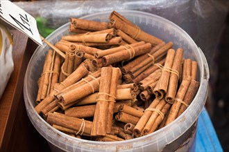 Bunches of cinnamon sticks in the herbal shop