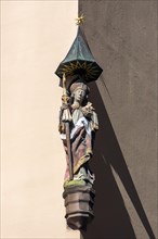 Sculpture of a saint, house figure on a residential building, Albrecht-Duerer-Platz, Nuremberg, Middle Franconia, Bavaria, Germany, Europe