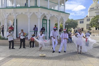 Local dance group with musician for tourists, in the Parque Independenzia in the Centro Historico, Old Town of Puerto Plata, Dominican Republic, Caribbean, Central America