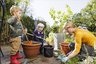 Children help with the gardening. Bonn, Germany, Europe