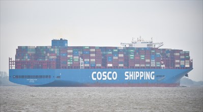 Container ship Cosco Shipping in fog on the Elbe near Hamburg, Schleswig-Holstein, Germany, Europe