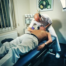 General practitioner in chirotherapy for joint blockages and back pain in 1965-71, DEU, Germany, Europe