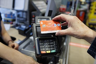 Payment with a girocard in the supermarket. Radevormwald, Germany, Europe