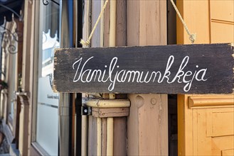 Wooden sign on facade, with inscription Vanilla Donuts, Finnish, Old Town of Rauma, UNESCO World Heritage Site, Satakunta, Finland, Europe