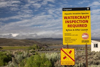 Gunnison, Colorado, A sign at Curecanti National Recreation Area warns boaters that inspections for invasive species are required at Blue Mesa Reservoir. Colorados inspection program aims to keep zebr...