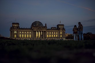 The evening sky is reflected in the windows of the Reichstag building on an evening in autumn. Berlin, Berlin, Germany, Europe