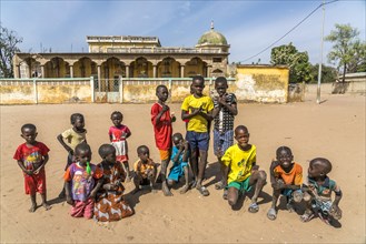 Group of African children in front of the mosque in Missirah, Sine Saloum Delta, Senegal, West Africa, Africa