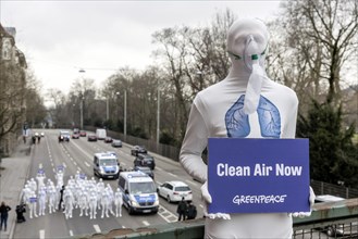 Protest of the environmental organisation Greenpeace, on the Bundesstrasse 14 40 activists demand better air quality, the Neckartor is considered the most polluted street in Germany with high levels o...