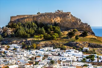 View of Lindos with white houses and Acropolis, Rhodes, Greece, Europe