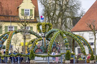 Easter fountain, 11000 hand-painted eggs decorate the village fountain at Easter in Schechingen, Ostalbkreis, Baden-Wuerttemberg, Germany, Europe