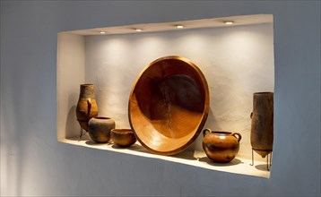 Decoration of clay bowls in front of white wall, Spain, Europe