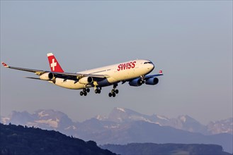 Airport ZRH with aircraft on approach of the airline Swiss, Airbus A340-300, Zurich, Switzerland, Europe
