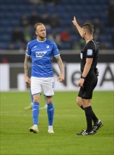 Referee Daniel Schlager signals Kevin Vogt TSG 1899 Hoffenheim