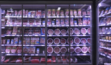 Sausages on offer in the refrigerated shelves in a supermarket, Bavaria, Germany, Europe