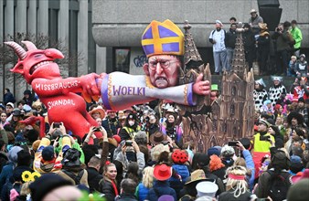 Theme floats by Jaques Tilly: Abuse scandal in the Catholic Church surrounding Cardinal Rainer Maria Woelki, Rosenmontagszug in Duesseldorf, North Rhine-Westphalia