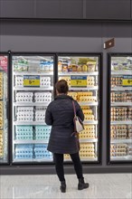 Macomb Twp., Michigan, A woman shops for eggs at a Meijer Grocery store, newly opened in suburban Detroit. The stores grocery-only concept is new for the chain. Its huge supercenters sell clothing, ho...