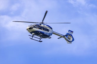 Police helicopter in flight, Airbus Helicopter EC145, Stuttgart, Baden-Wuerttemberg, Germany, Europe
