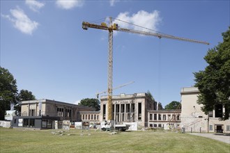 Building crane, building site, dilapidated house of culture, Koserow, Usedom Island, Mecklenburg-Western Pomerania, Germany, Europe