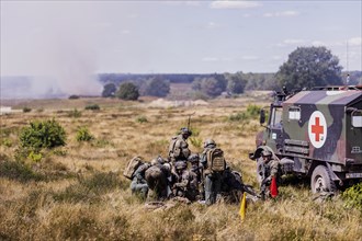Soldiers of the Jaegerbataillo taken during a rescue of casualties in the context of a simulated combat situation at the Bundeswehr Combat Training Centre in Letzlingen, The soldiers wear AGDUS equipm...