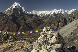 The eight-thousander Cho Oyu, Tenzing Peak and Hillary Peak, Taboche, along the highest mountain below eight-thousands, Gyachung Kang, seen among many other Himalayan mountains from a glacial moraine ...