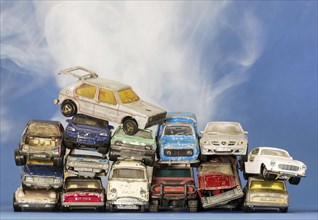 Symbol photo scrap cars, broken Matchbox toy vehicles, climate change, studio shot, Germany, Europe