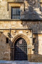 Gate to the French Hostel, Knights Street in Old Town from the time of the Order of St. John, the only surviving 16th century street in the late Gothic style, Oddos Ippoton, Rhodes Town, Greece, Europ...